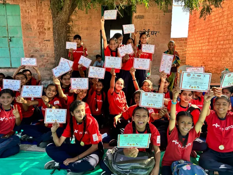 Hamari Laado students holding their completion certificates
